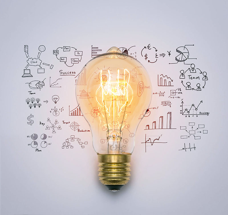 A light bulb surrounded by various business icons, symbolizing innovation and creative ideas in the startup world.
